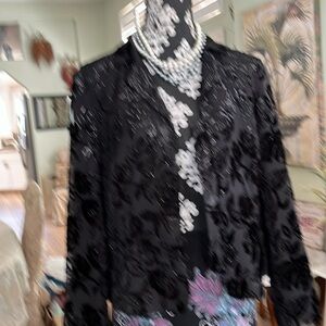 Cocktail time.  Beautiful and flattering tea length skirt and jacket size 12.